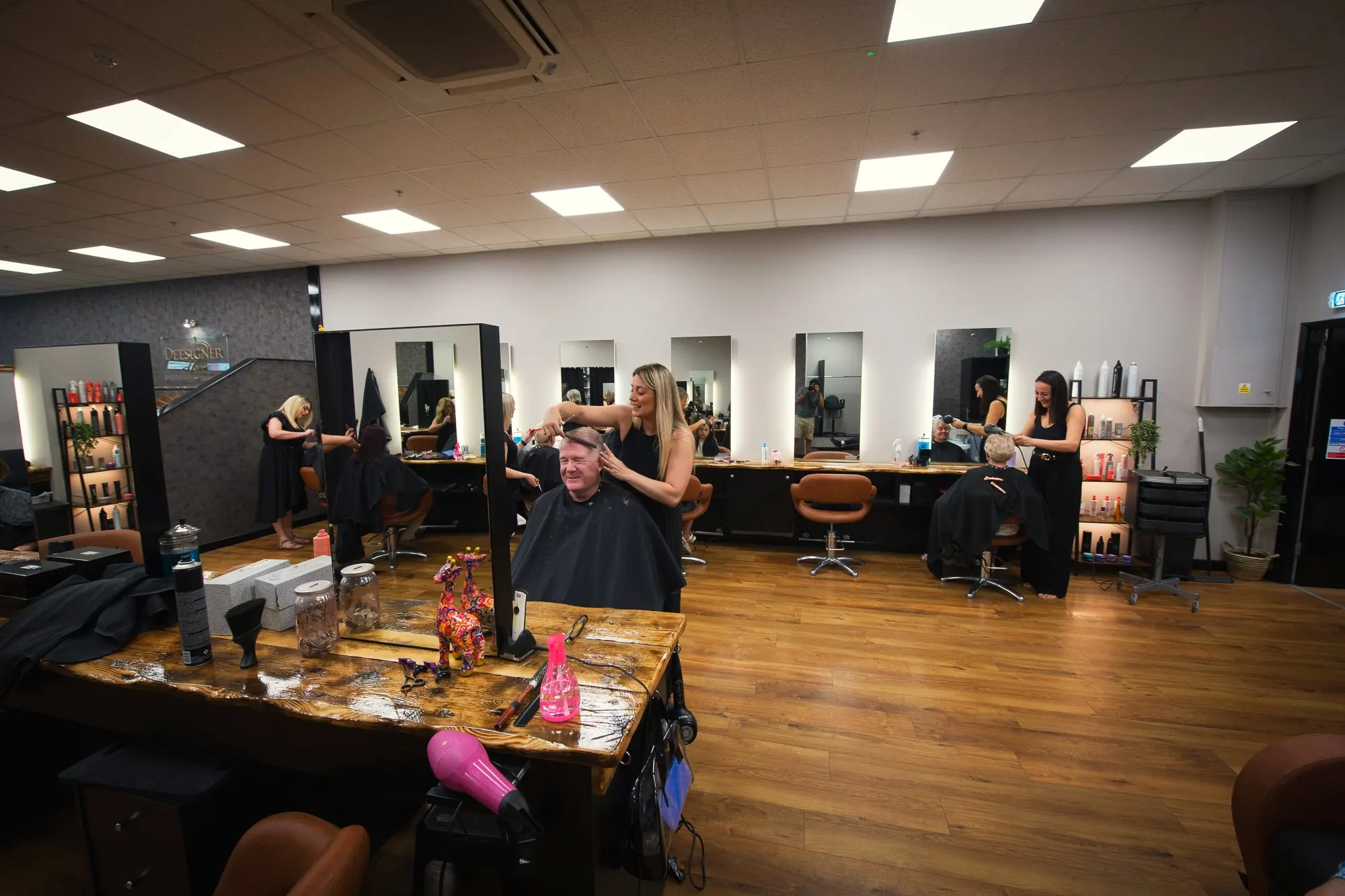 Stylists at work on the salon floor at Deesigner Hair Studio, Ipswich